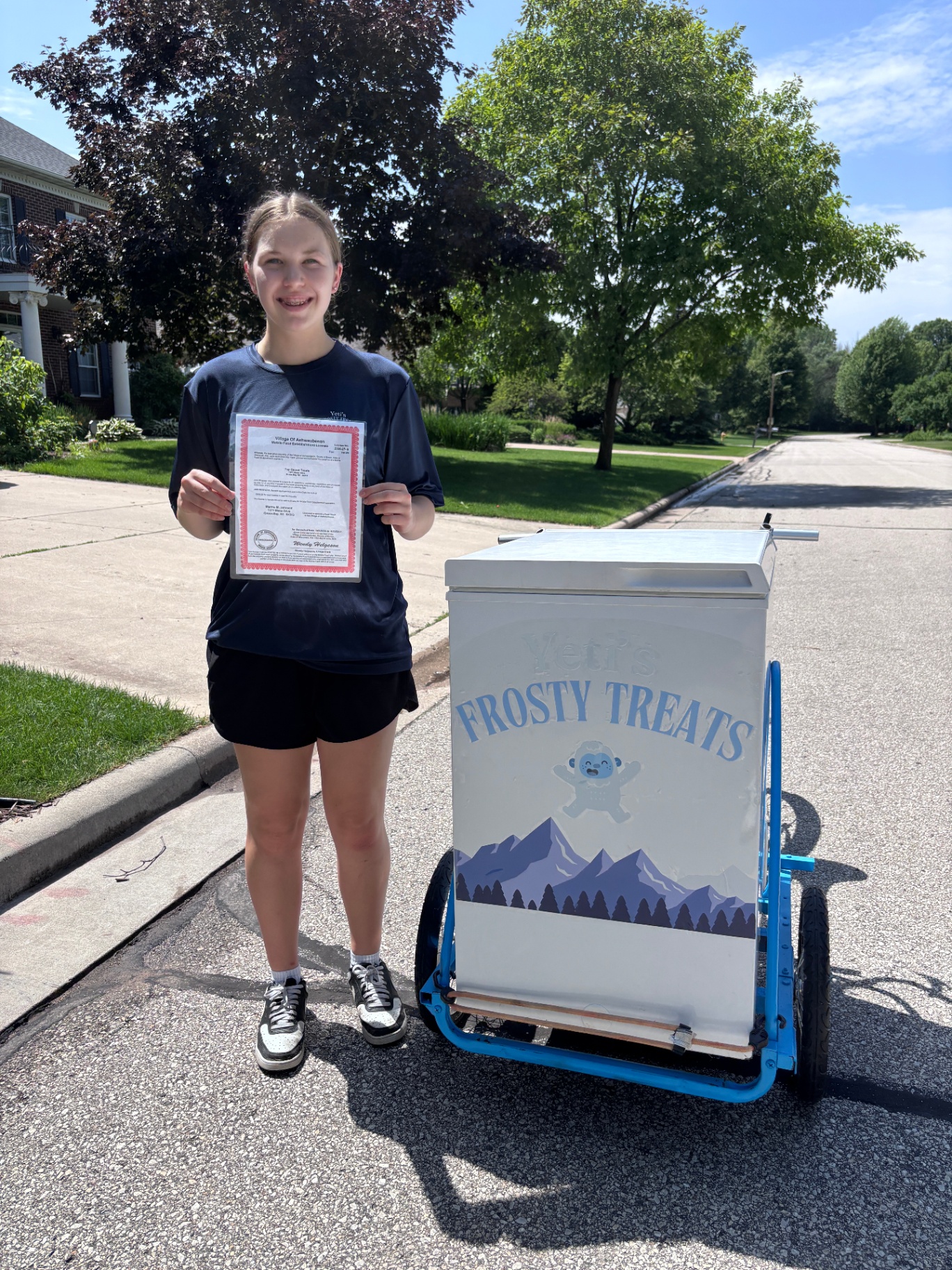 Yeti's Frosty Treats owner with her food establishment license